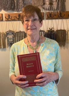 woman holding a red book