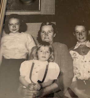 adult female, 2 female children, 1 male child